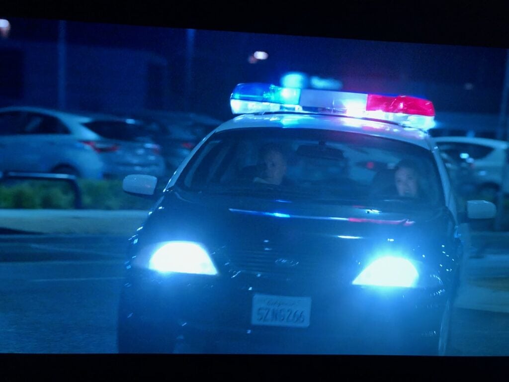 A screenshot from The Very Excellent Mr Dundee showing a Ford AU Falcon dressed up as a LAPD patrol car